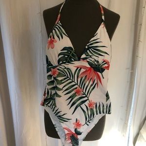 One piece swimsuit size medium and beach skirt by SHEIN.